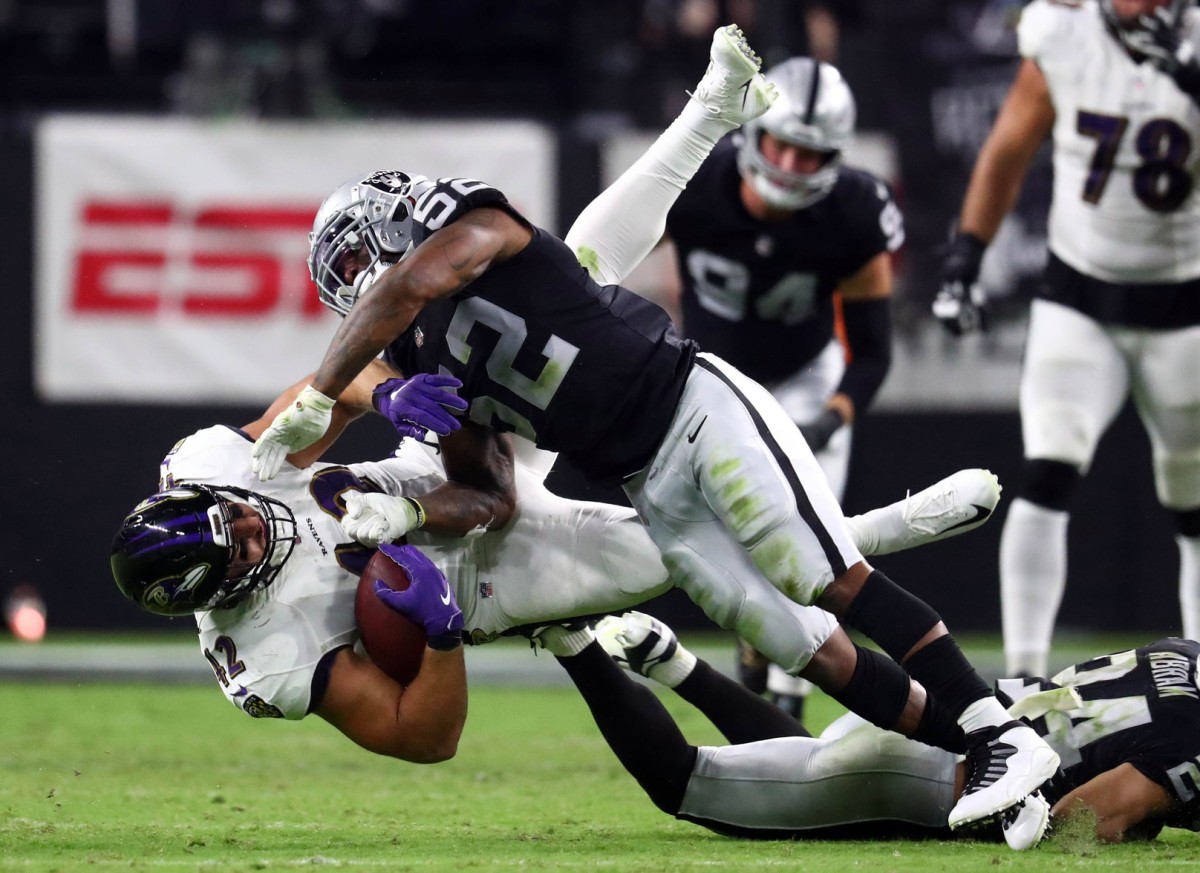 Sep 13, 2021; Baltimore Ravens fullback Patrick Ricard (42) is brought down by Las Vegas Raiders linebacker Denzel Perryman (52). Mandatory Credit: Mark J. Rebilas-USA TODAY Sports